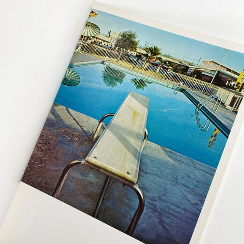 Nine Swimming Pools and a Broken Glass