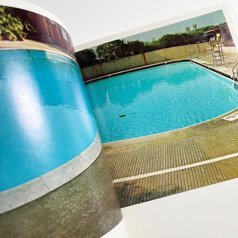 Nine Swimming Pools and a Broken Glass