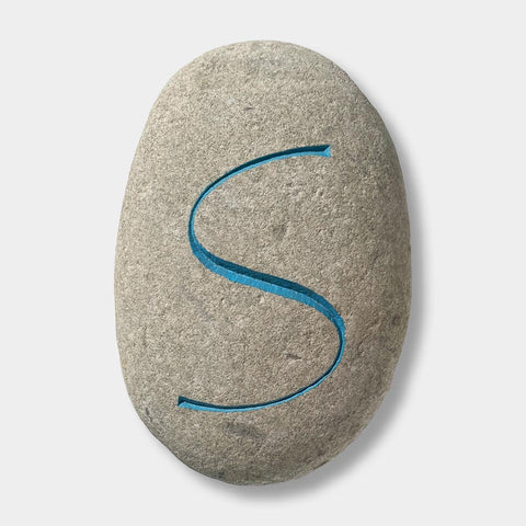 [a cap S cut by Philip Surey]